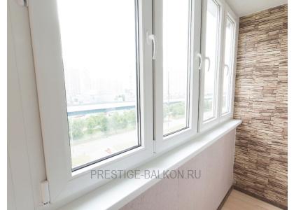 Тёплое остекление балкона профилем КВЕ и комбинированной отделкой пластиком и деревом в Балашихе