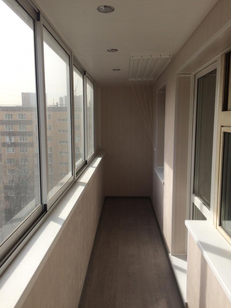 Теплое остекление балкона профилем KBE и установка сушилки в Балашихе